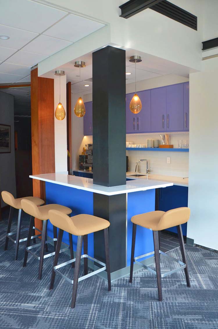 Kitchen area for corporate office designed around pole