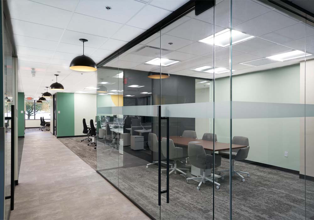 Modern conference room corporate office design enclosed by glass