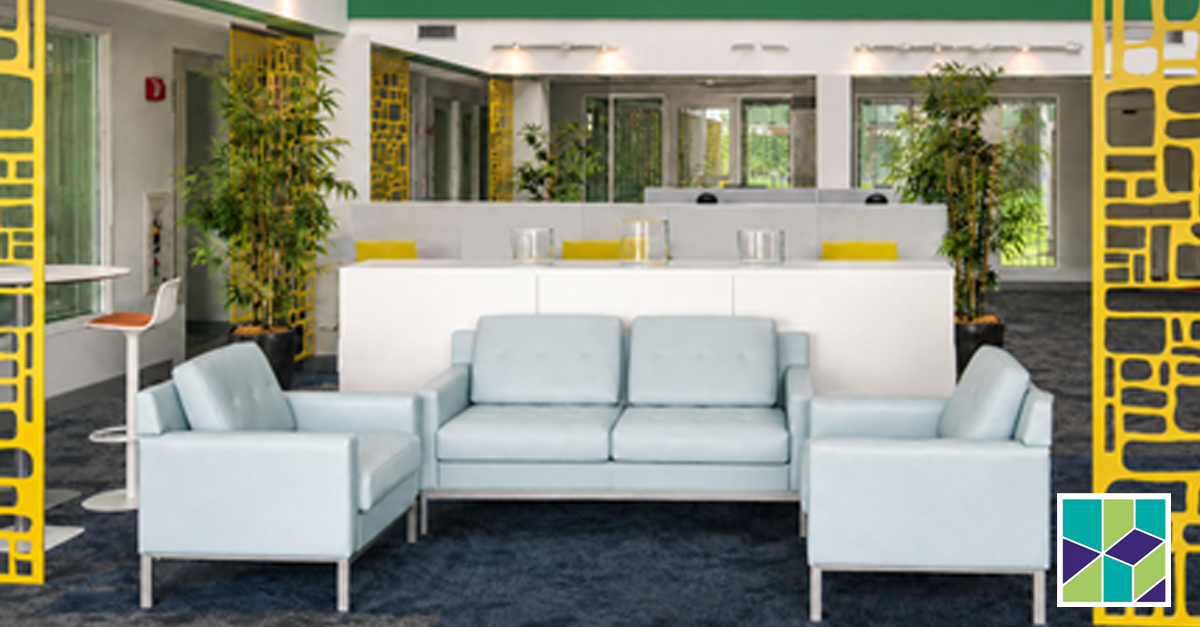 Modern office lounge seating area with light blue sofas, yellow accent walls, and greenery — a flexible space for workplace celebrations and employee experience